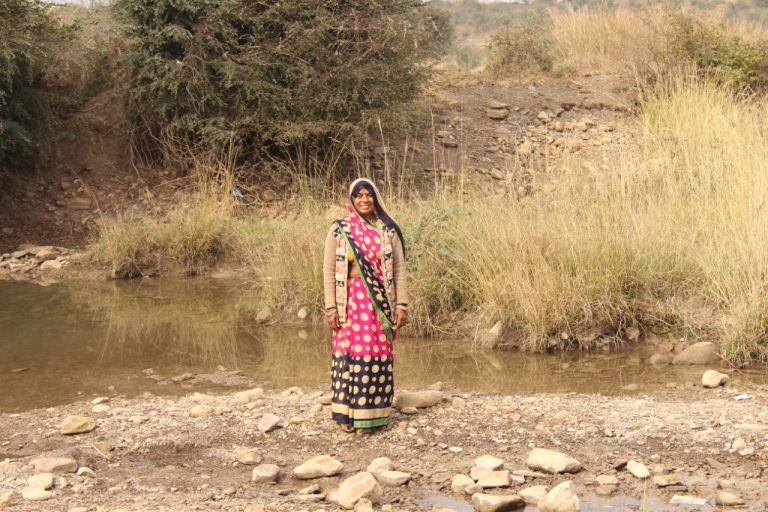 Tribal Farmer Woman Drags Water to Farms