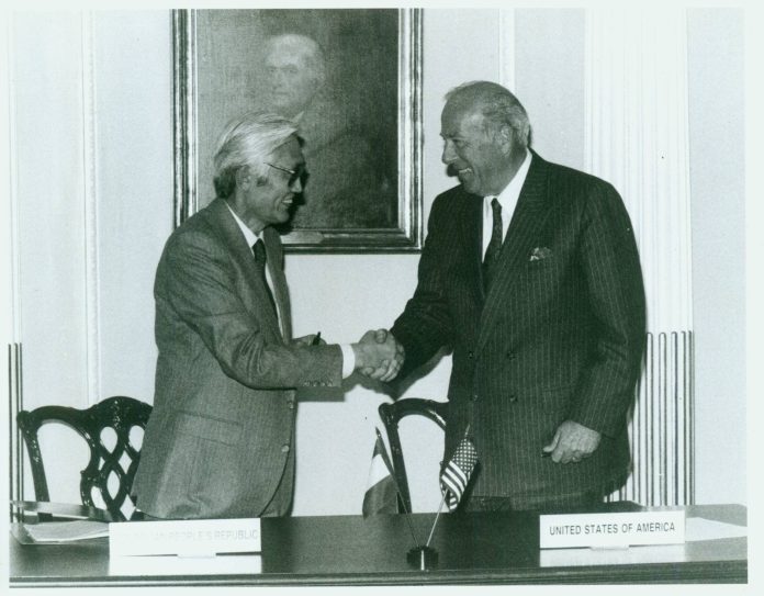 U.S. Secretary of State George P. Shultz signing the agreement establishing formal U.S.-Mongolia diplomatic relations in 1987.