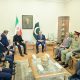 Iranian and Pakistani diplomatic officials during tense mediation talks.